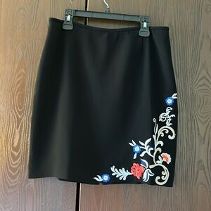 Tahari petite black skirt with colorful embroidery on one side. Size 14P.